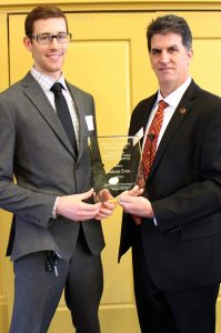 Dakota Even receives plaque from Hillier