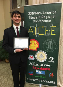 Martin Asama with award