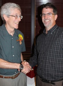 Glatz in congratulated by Chemical and Biological Engineering department chair Andy Hillier. Glatz hired Hillier as a professor in the department in 2003.
