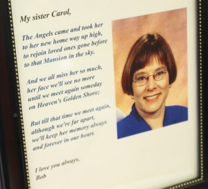 A memorial plaque from Carol Vohs Johnson's funeral was on display at the medallion ceremony for Carol's Chair.