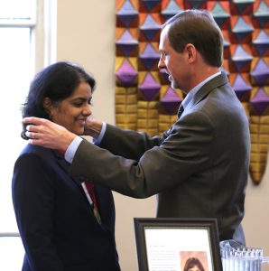 Dr. Surya Mallapragada receives the medallion for Carol's Chair from Iowa State University Senior Vice President and Provost Jonathan Wickert.  (Photo by Christopher Gannon/Iowa State University)