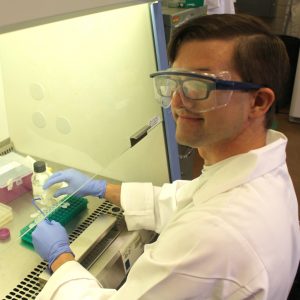 Adam Carr, a student at Brigham Young University, works on his BioMaP REU research project in Sweeney Hall.