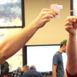 Students with paper helicopters