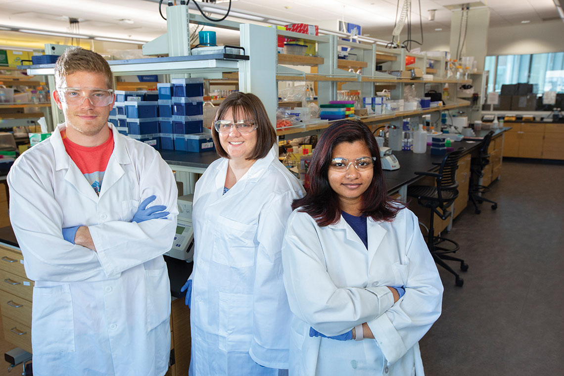 Nanovaccine Institute graduate students in laboratory