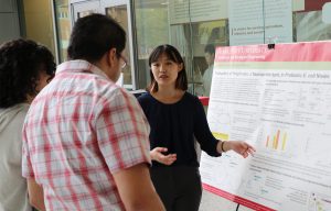 Maple Chen displays research poster