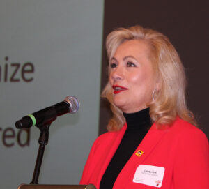 Lori Ryerkerk speaks following her induction