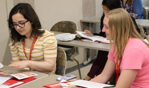 BioMaP students looking over department materials at orientation