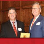 CBE chair Andy Hillier presenting Hall of Fame plaque to inductee Mark Lashier