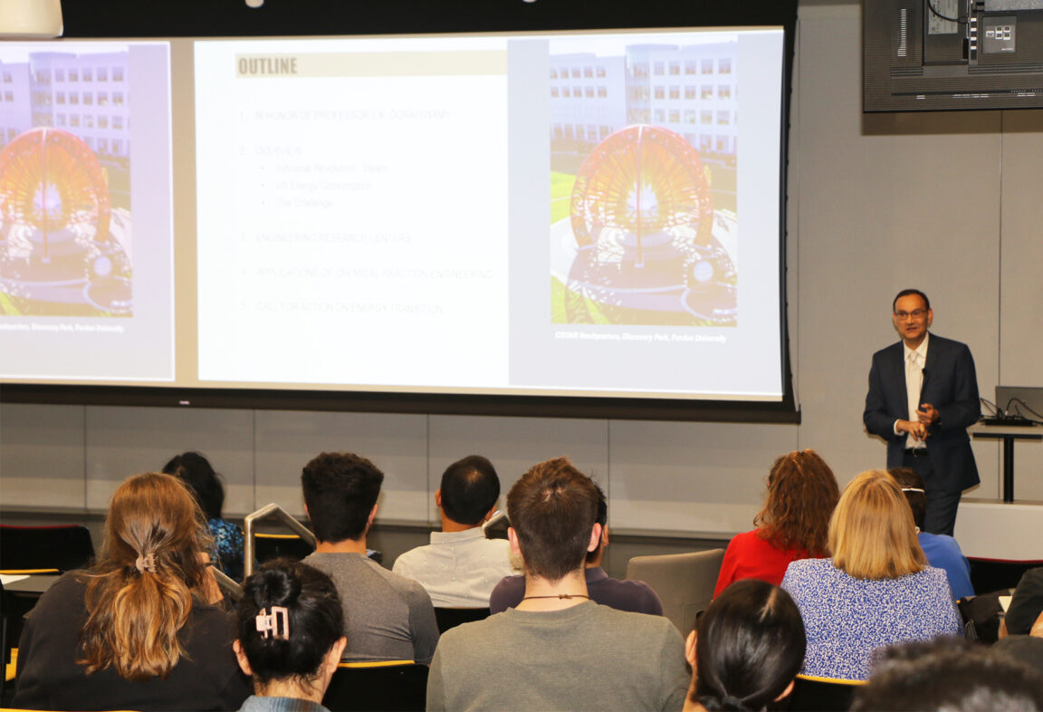 Speaker and audience members at seminar